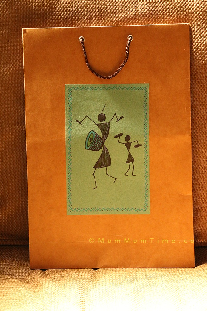 Gift bag with warli design made using a shopping bag